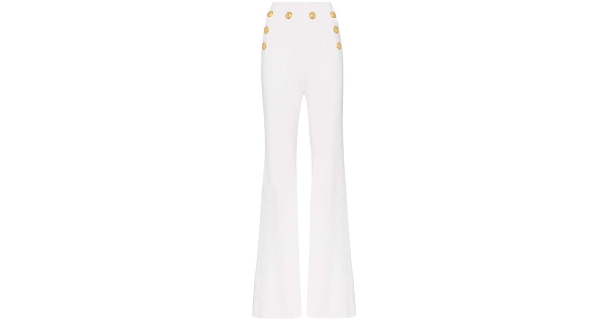 white high waisted pants with gold buttons
