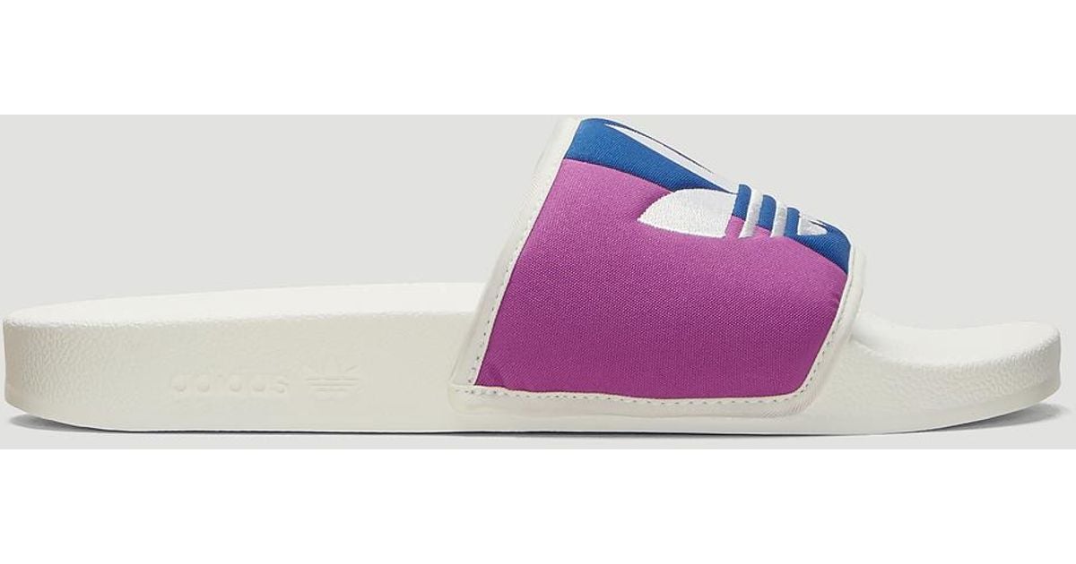 white adidas adilette slides