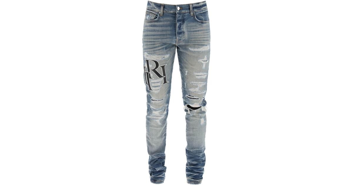 Amiri Destroyed Jeans With staggered Logo in Blue for Men | Lyst