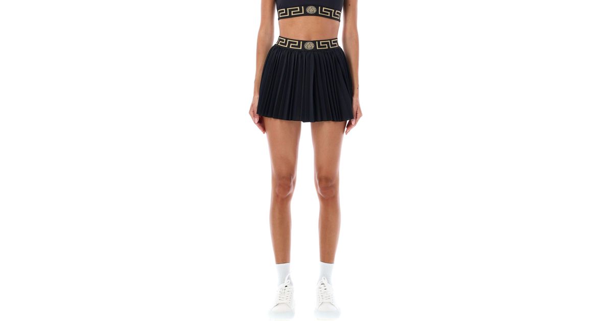 Versace Greca Border Pleated Gym Skirt in Black | Lyst