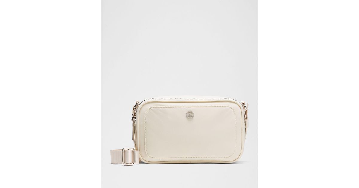 lululemon crossbody camera bag white Light Ivory Seattle Kraken This lululemon Crossbody Camera Bag offers a sleek and contemporary way to carry your essentials while repping the Tampa Bay Lightning This cross Newest additions Cinchable fleece