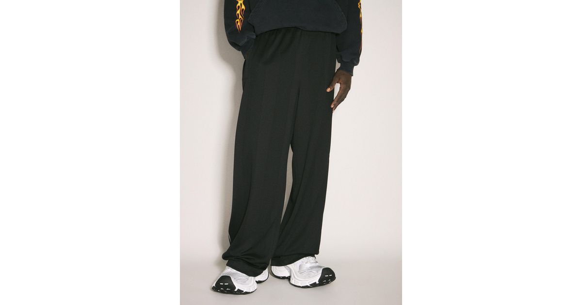 Balenciaga Burning Unity Baggy Trackpants in Black for Men Balenciaga Burning Unity Baggy Trackpants in Black for Men