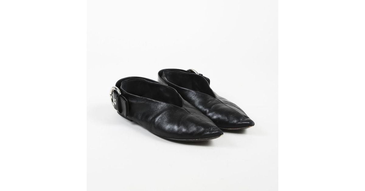 black leather pointed toe flats