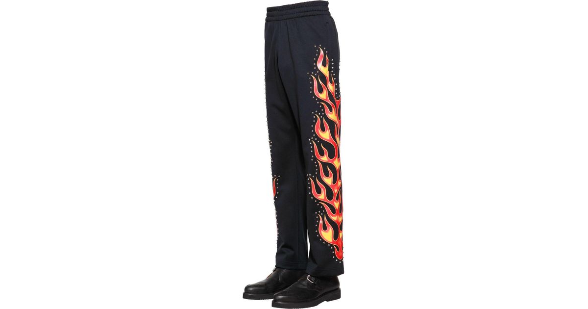 Pantaloni Stampa Fiamme Con Borchie da Uomo di Moschino in Nero | Lyst
