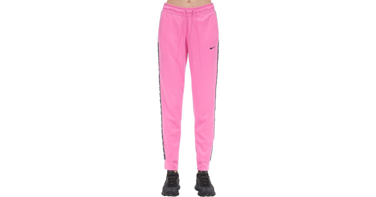 nike sportswear jogger logo tape pink