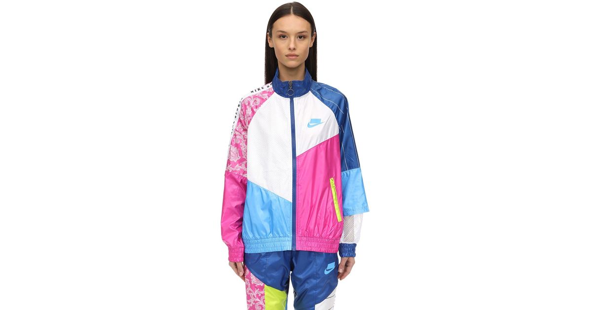 nike woven track top