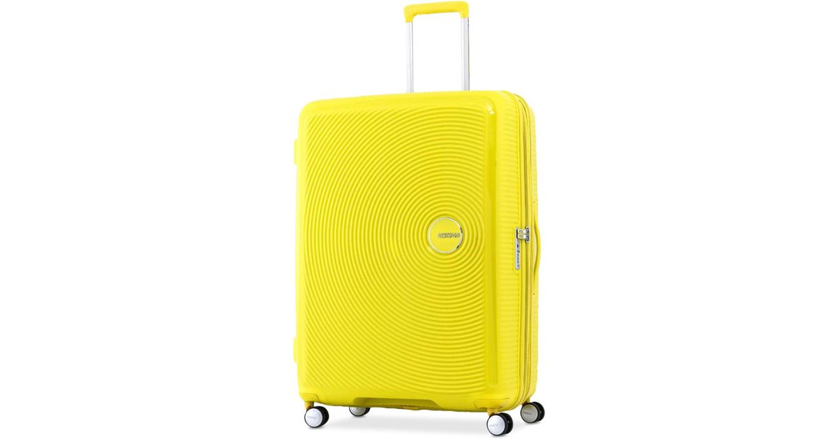 yellow american tourister