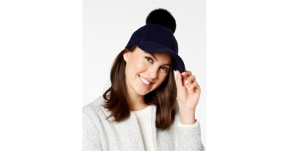 baseball cap with fur pom pom