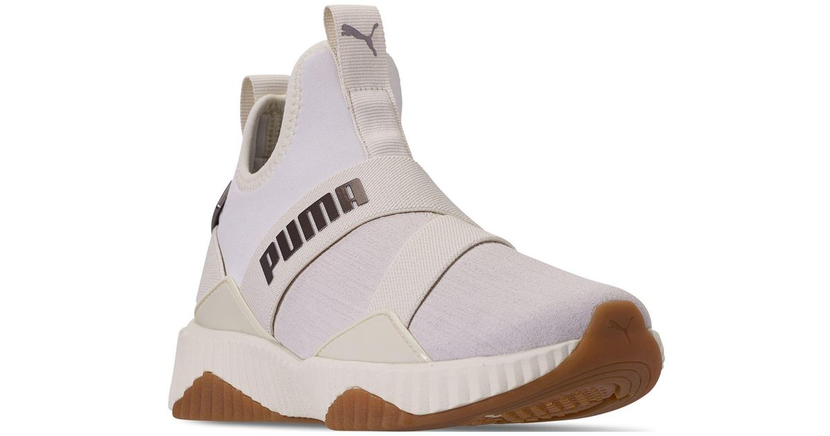 puma defy mid lux