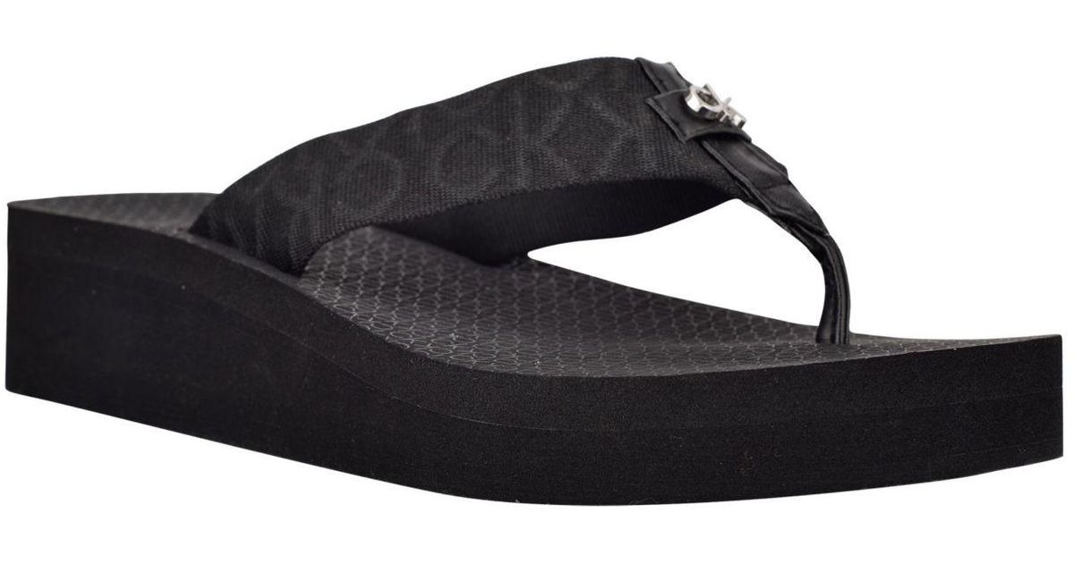 Calvin Klein Meena Beach Slip-on Wedge Flip Flops in Black | Lyst