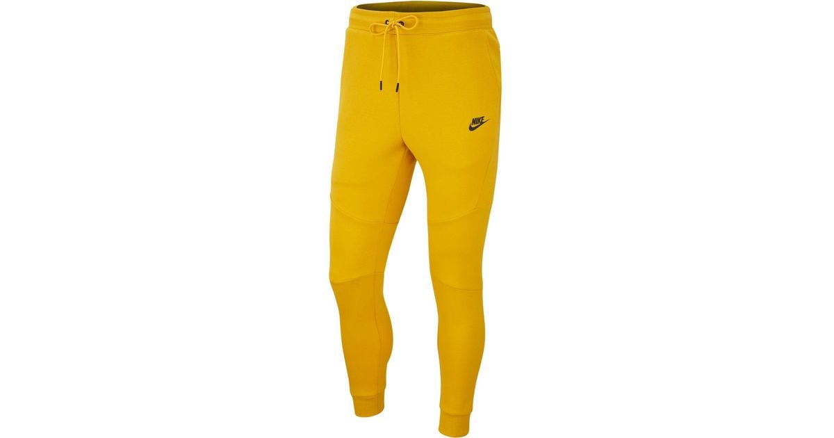 yellow nike tech pants