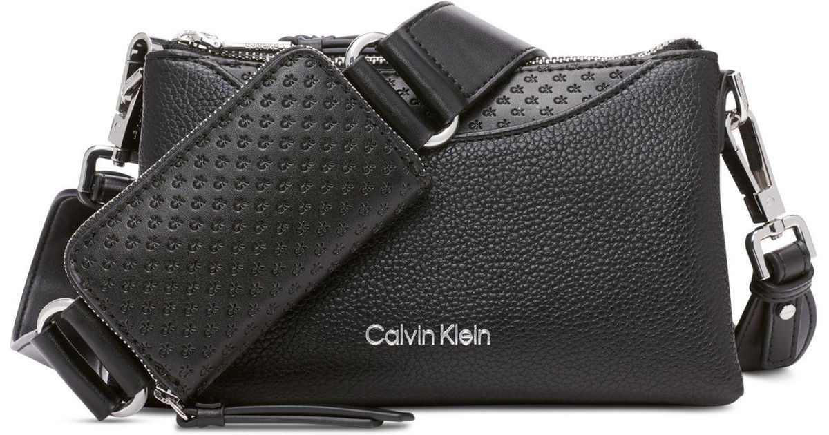 Calvin Klein Chrome Embossed Signature Zippered Crossbody in Black | Lyst