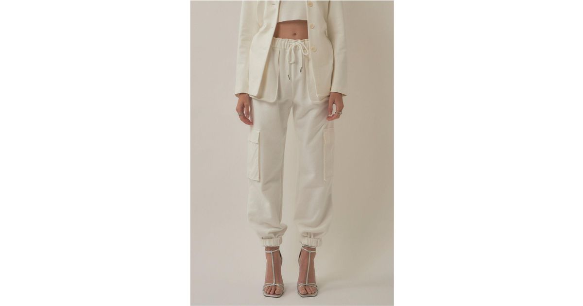 white pants and top