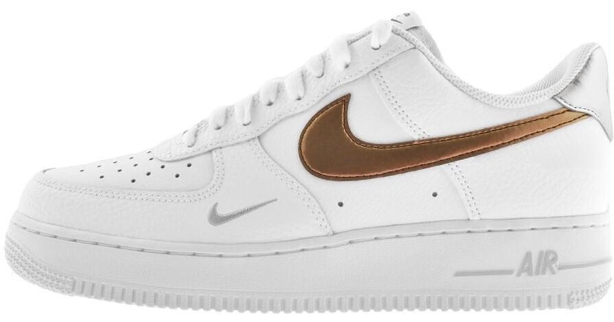 Nike air force 1 trainers white metallic rose gold top