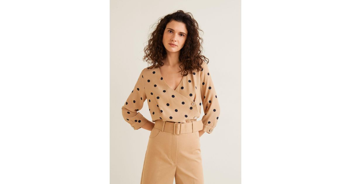 beige polka dot top