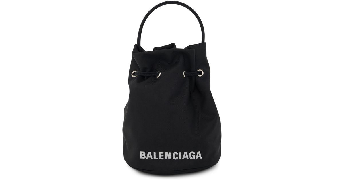 Balenciaga Leather Wheel Xs Drawstring Bucket Bag In Black | Lyst