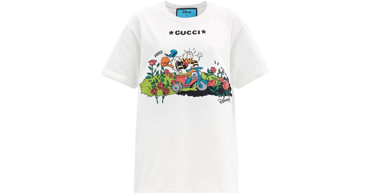 Gucci Donald Duck embroidered t-shirt ($750) ❤ liked on Polyvore featuring  men's fashion, men's clothin…