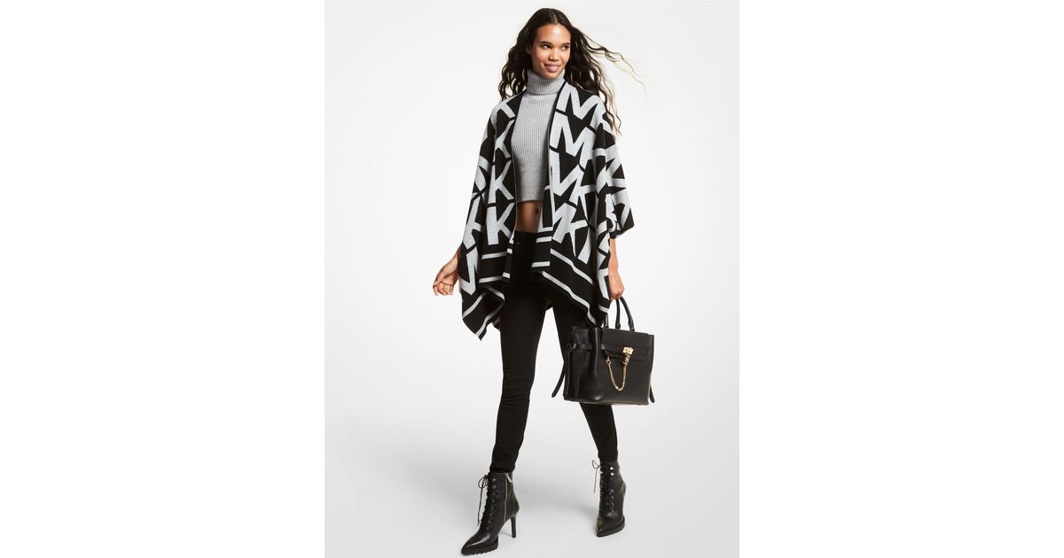 Womens Jumpers and knitwear MICHAEL Michael Kors Jumpers and knitwear - Save 14% MICHAEL Michael Kors Wool Logo Reversible Poncho in White/Black Black 