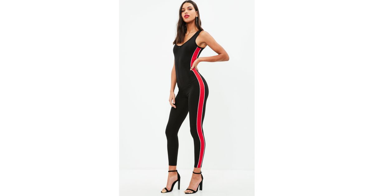 black jumpsuit with red stripe