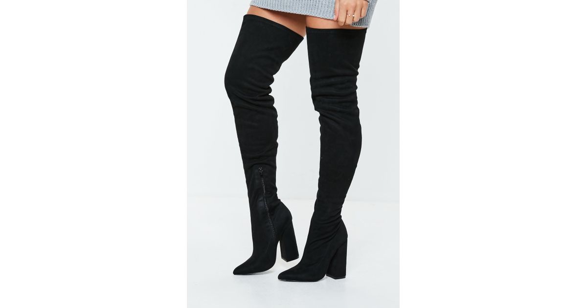 black over the knee flared heel boots