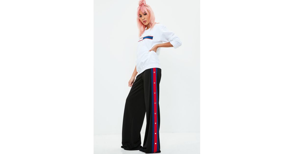 adidas originals mixed stripe popper pants in black and white