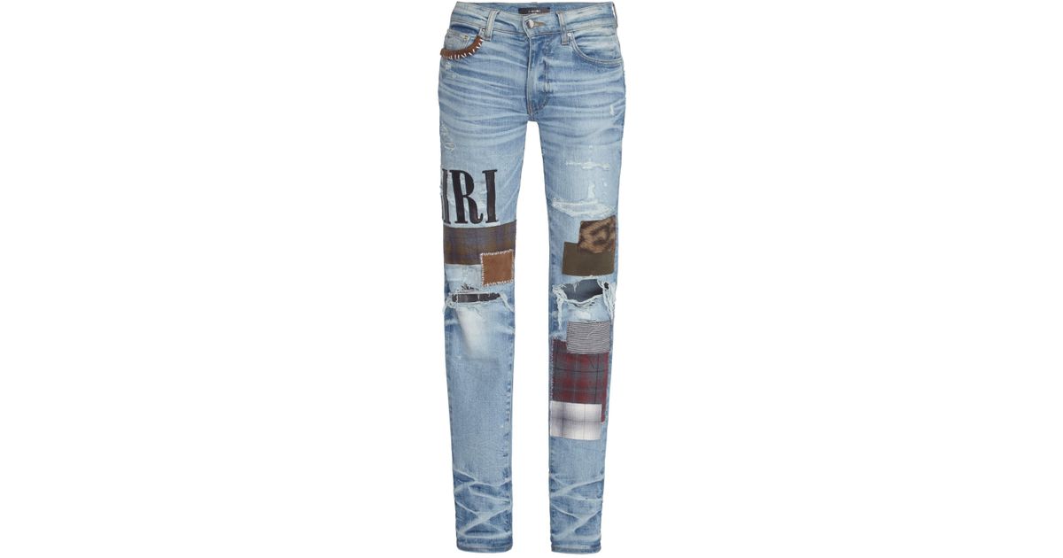 amiri grunge patch jeans