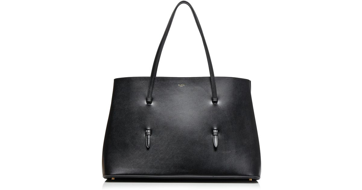 ALAIA バッグ アライア Mina 50 Large leather tote bag 752509 Mina 50 Large leather tote bag in black - Alaia | Mytheresa