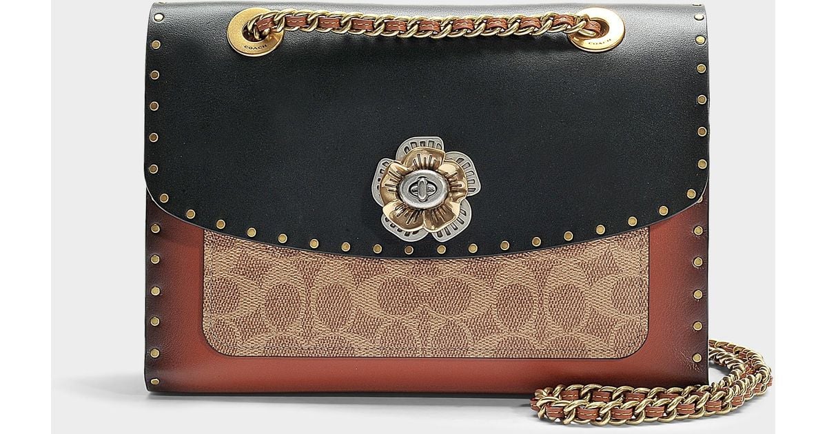Coach parker in signature canvas with rivets and snakeskin detail clearance