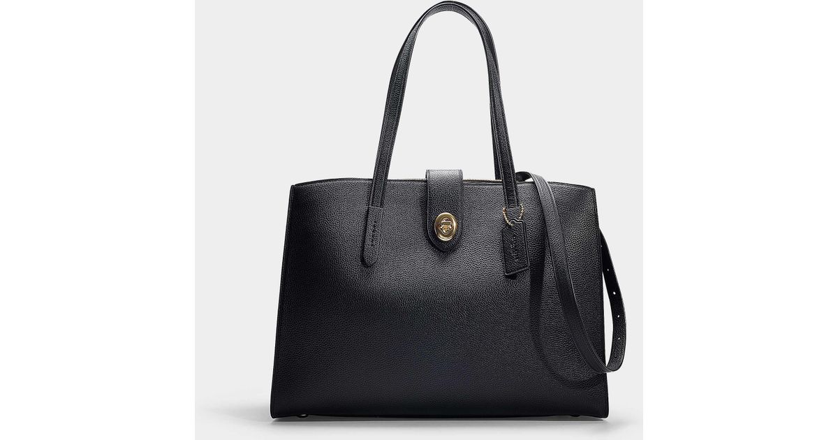 coach turnlock charlie carryall