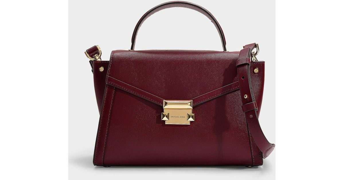 Michael Kors oxblood Whitney Small Convertible Top-Handle Messenger Bag at  FORZIERI