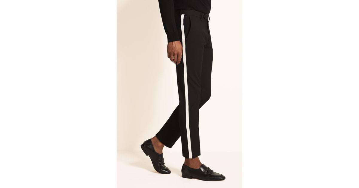 black trousers with white side stripe