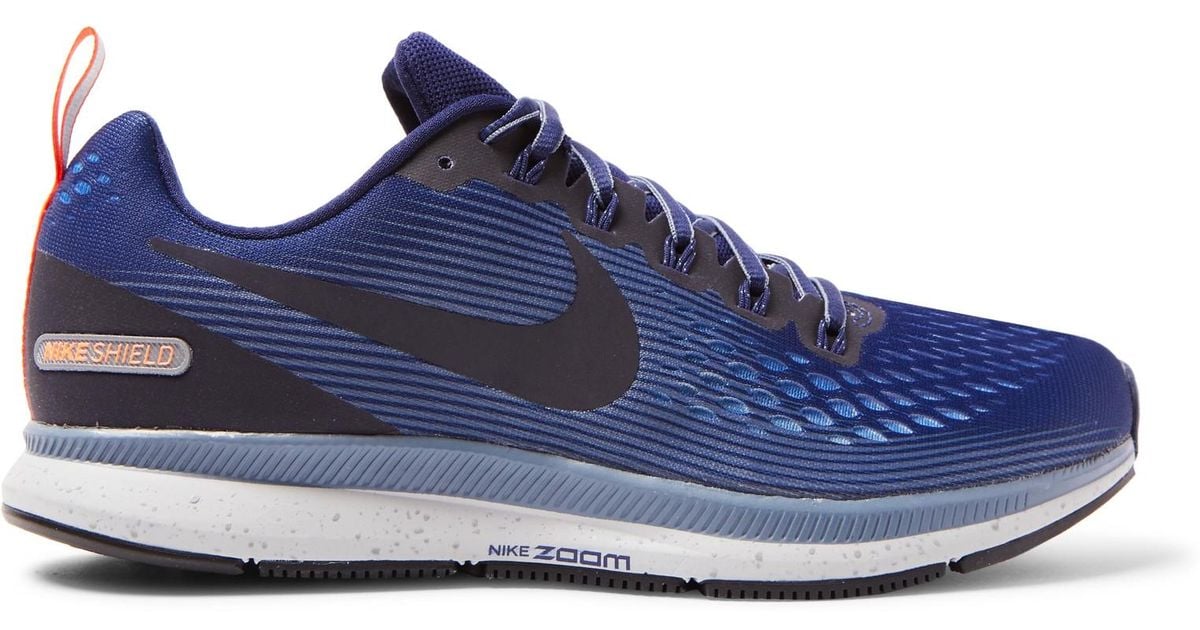 Nike Blue Air Zoom Pegasus 34 Shield Flymesh Sneakers for men Nike Blue Air Zoom Pegasus 34 Shield Flymesh Sneakers for men