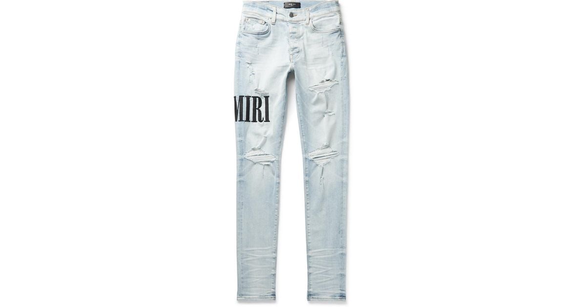 Amiri Skinny-fit Logo-embroidered Distressed Stretch-denim Jeans in ...