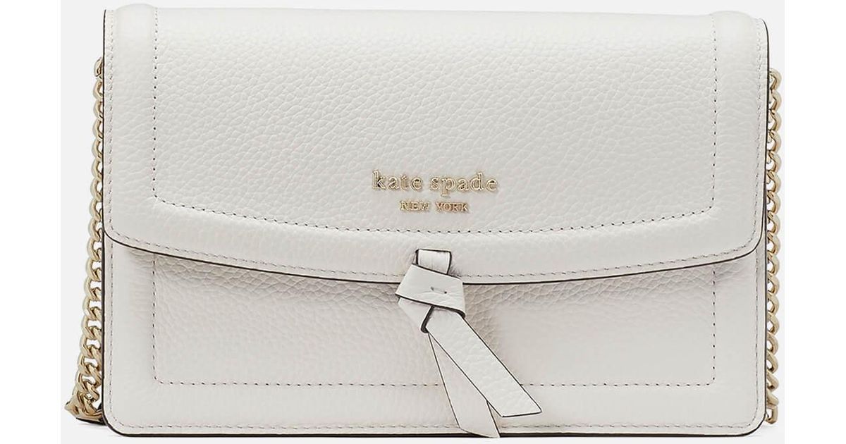 Kate Spade Knott Pebbled Leather Flap Crossbody Bag in White | Lyst