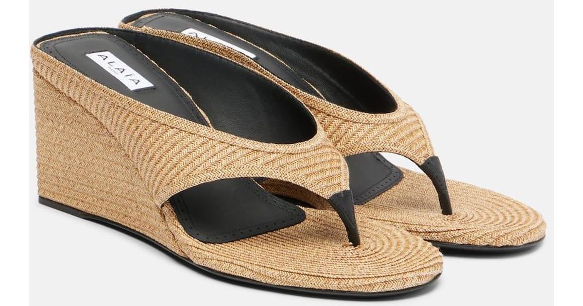 ALAIA WEDGE THONG SANDALS 25S IN BROWN SATIN