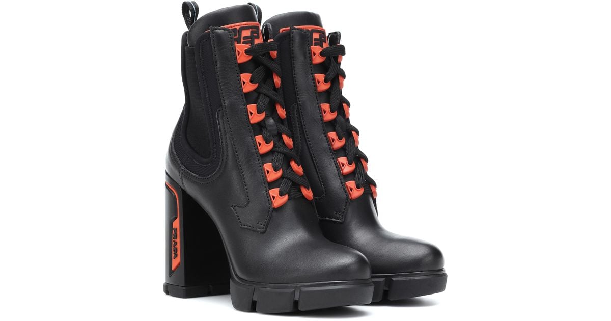 orange and black prada boots