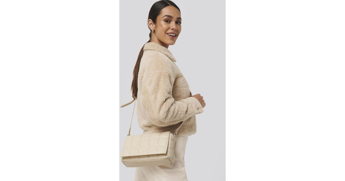 tan quilted crossbody bag
