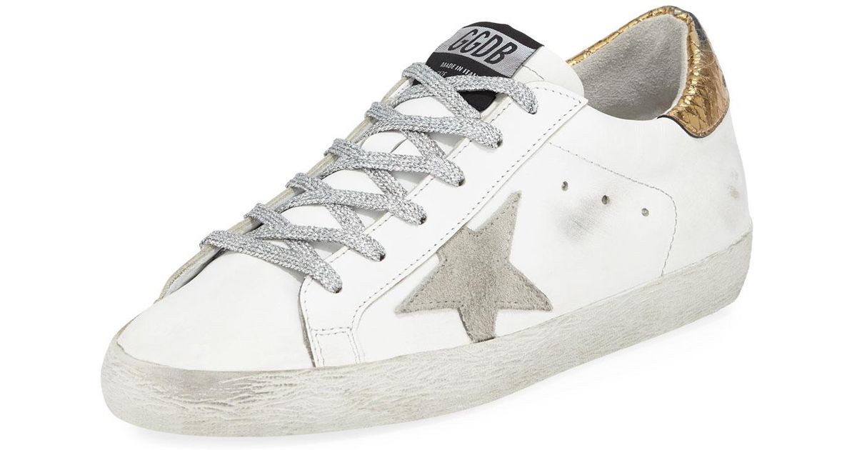 gold and silver golden goose sneakers