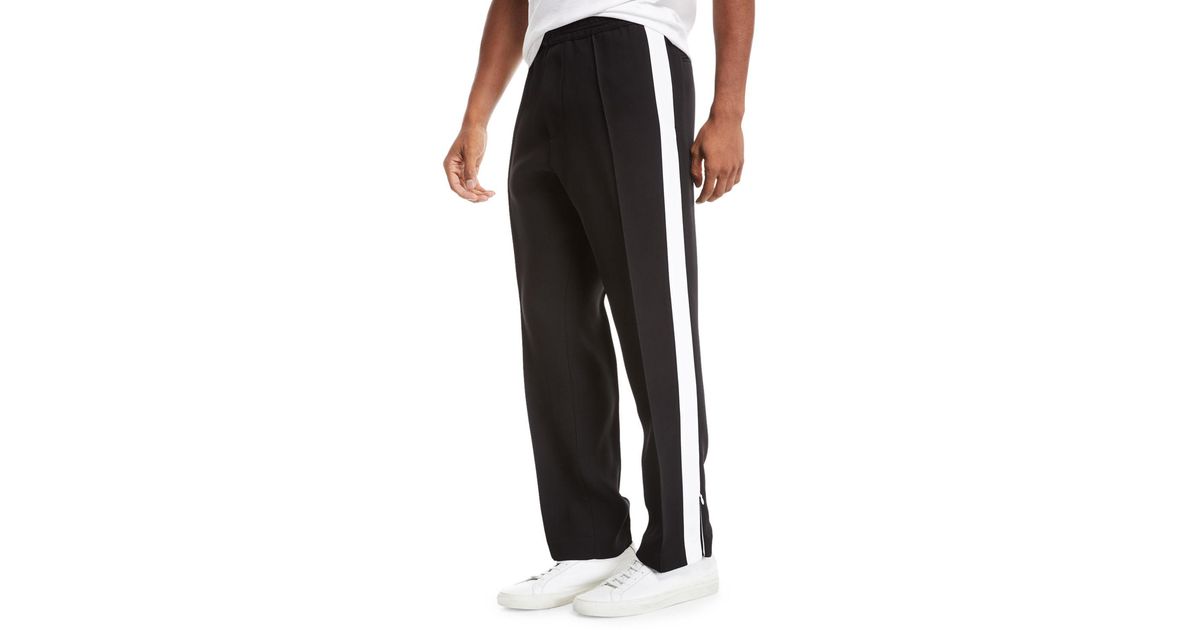 men's black track pants with white stripe