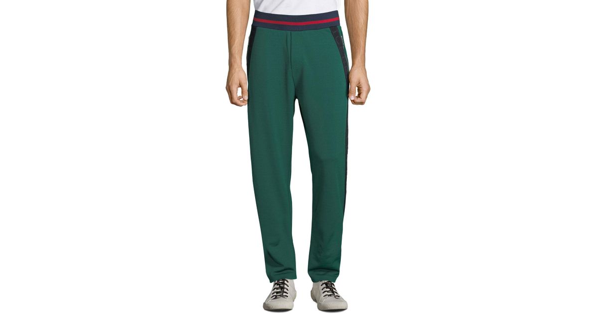 green tape logo track pants