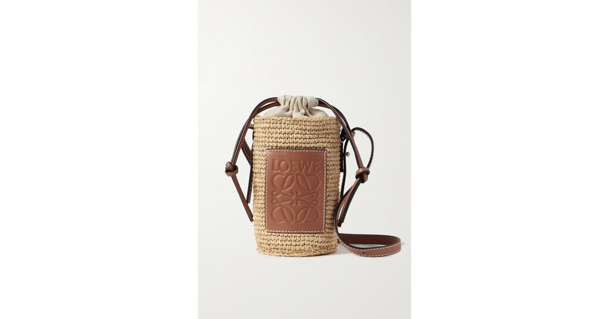 + Paula's Ibiza leather-trimmed raffia bucket bag