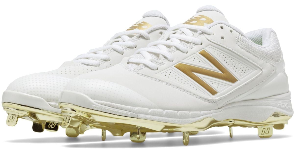 white and gold new balance cleats