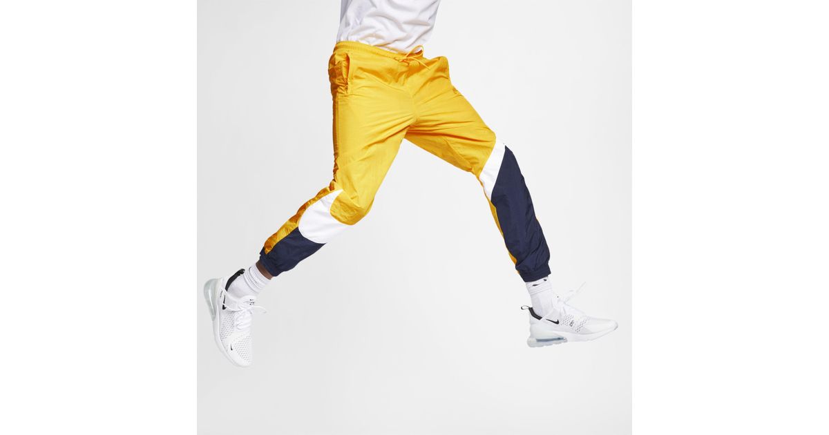 Pantalon tissé Sportswear Nike pour homme en coloris Jaune - Lyst
