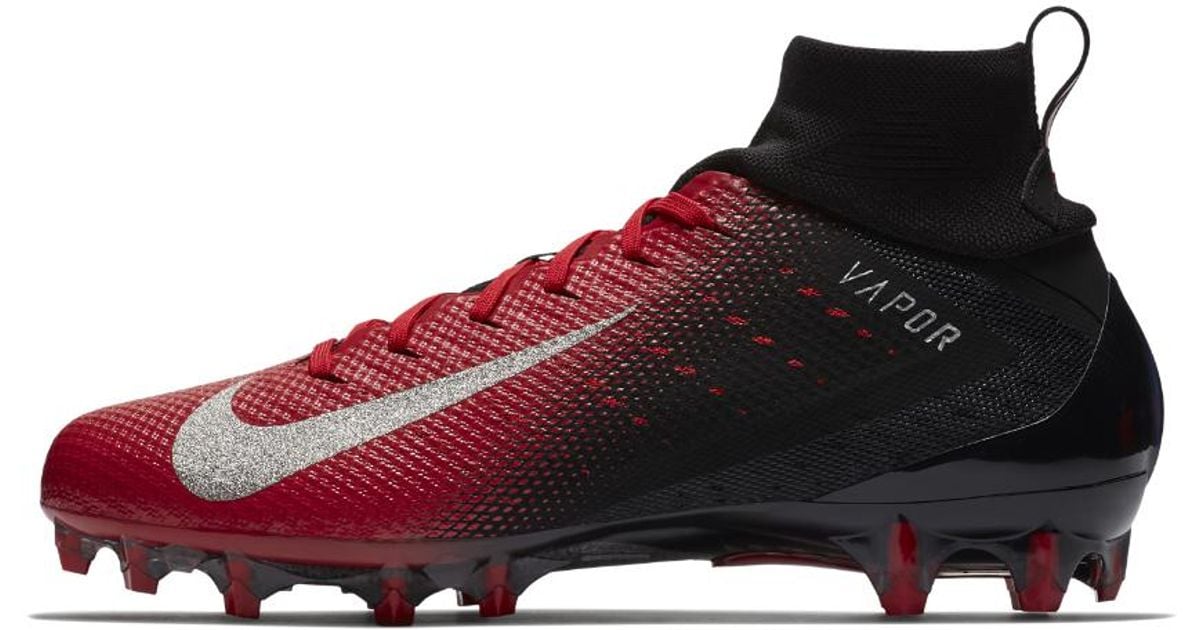 red and black football cleats
