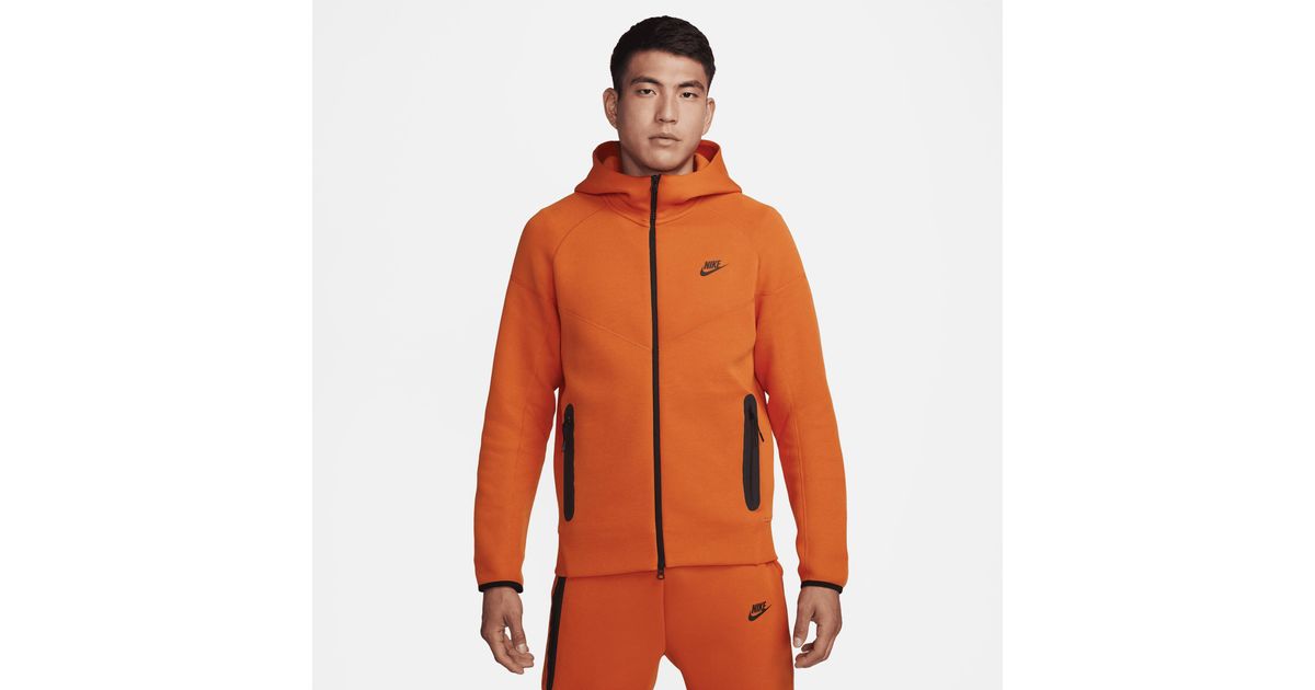 Orange nike tech hotsell