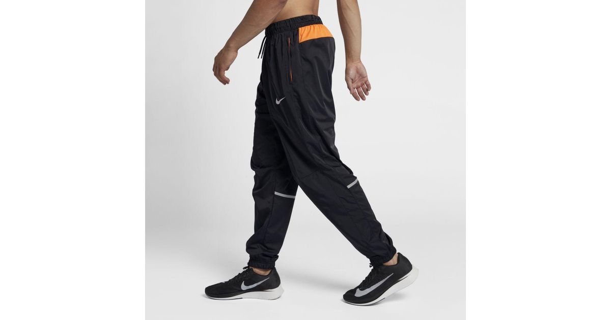 nike track pants reflective