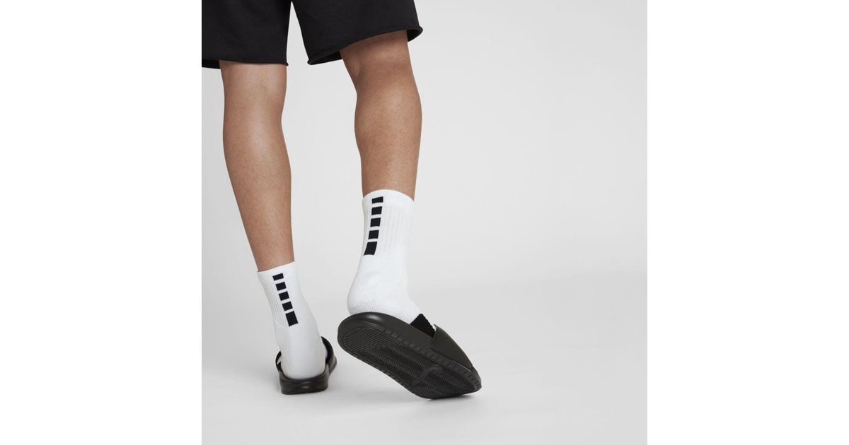 white basketball shoes with black socks
