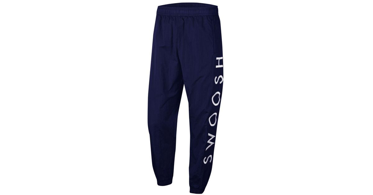 nike swoosh blue pants