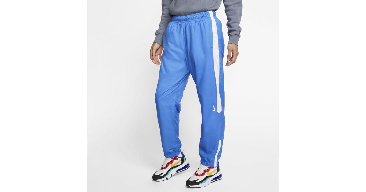 nike sb swoosh track pants blue