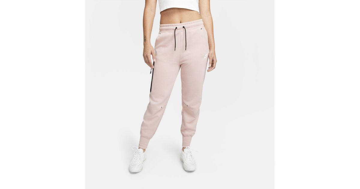 pink nike tech pants